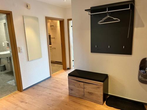 a room with a bathroom with a sink and a mirror at Naturstrand Apartment - 86m² - 4 Betten - Parkplatz in Hagermarsch