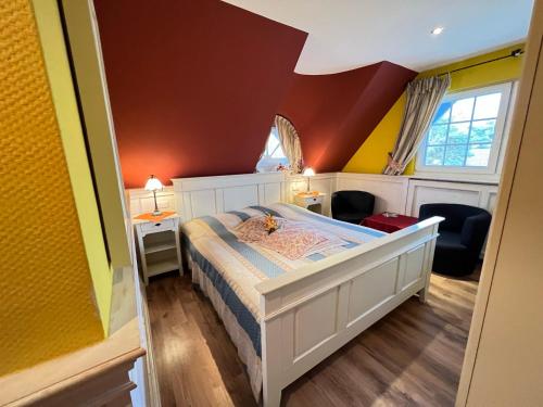 En eller flere senge i et værelse på Ferienhaus Brise - Skipper's Kabine