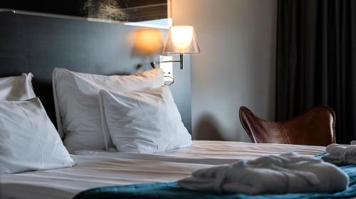 Postel nebo postele na pokoji v ubytování Quality Hotel Sundsvall