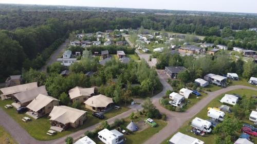 an aerial view of a small town with houses at Vakantiepark Camping de Peelpoort in Heusden