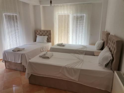 Katil atau katil-katil dalam bilik di Egnatia En Suites