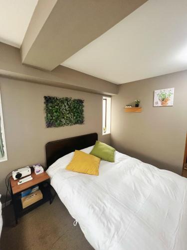 Ein Bett oder Betten in einem Zimmer der Unterkunft Shiki no Sai Asakusa
