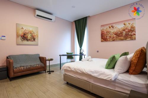 a bedroom with a bed and a chair at Private Studio in Bungalow by LilyandLoft in Subang Jaya