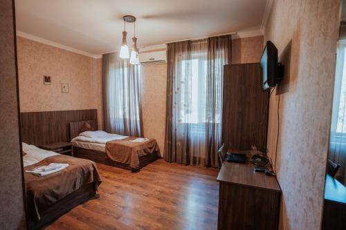 Postel nebo postele na pokoji v ubytování Hotel Metekhara