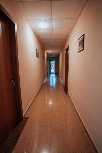 an empty hallway in an office building at Hotel Metekhara in Ambrolauri