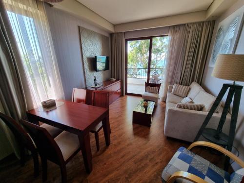 a living room with a table and a couch at Dreamland Oasis in Chakvi in Chakvi