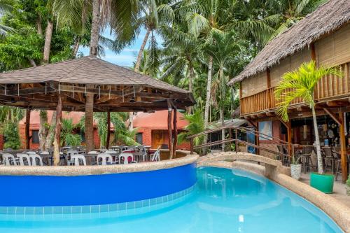 a resort with a swimming pool and a restaurant at Panglao Chocolate Hills Resort in Panglao Island