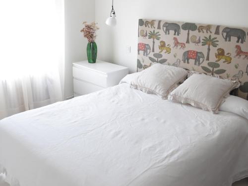 A bed or beds in a room at Nuevo! Coqueto apartamento en Tetuán