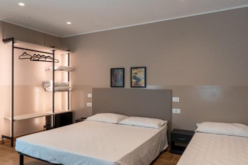 a bedroom with two beds in a room at M14 RESIDENZA BASSANELLO in Padova