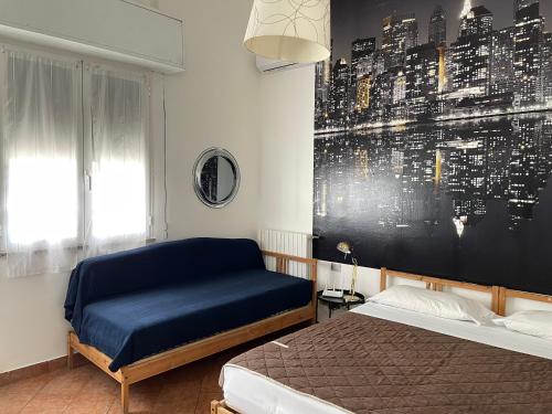 a bedroom with a bed and a painting on the wall at Milano Canal Apartments in Milan