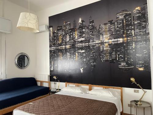 a bedroom with a wall mural of a city at Milano Canal Apartments in Milan