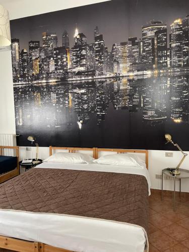 a bedroom with a large wall mural of a city at Milano Canal Apartments in Milan