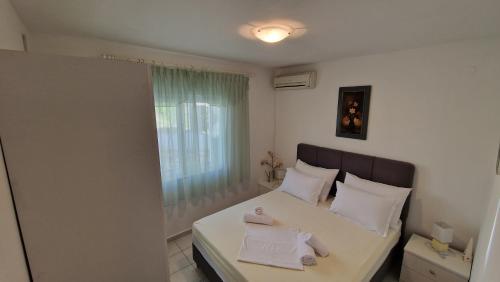 Ένα ή περισσότερα κρεβάτια σε δωμάτιο στο Apartments Sven