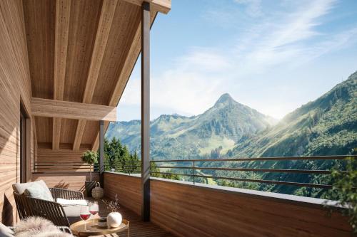 a balcony with a view of a mountain at Alpenstolz Damüls Haus 2 - Stilvoll urlauben in den Bergen in Damuls