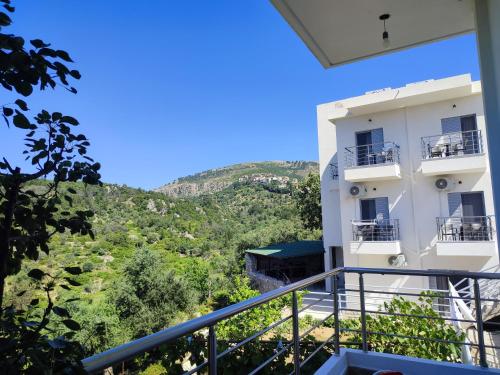 a view from the balcony of a building at Petros rooms in Himare