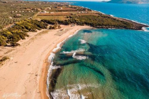 an aerial view of a beach and the ocean at Tom House 1 in Filiatra