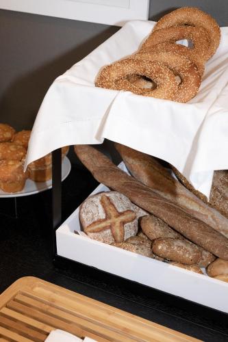 a box of breads and pastries on a table at ANEMI Folegandros in Karavostasi