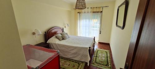 a small room with a table and a window at Lovely Modern Duplex 3 Bedroom Flat in Quiet Area in Tavarede