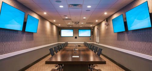 a conference room with a long table and chairs at Holiday Inn & Suites Philadelphia W - Drexel Hill by IHG in Drexel Hill
