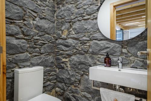 Et badeværelse på Mountain Retreat by Homie