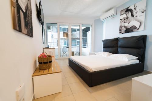 a bedroom with a bed in a room at Beachfront Marilyn in Durrës