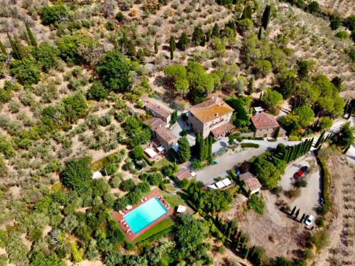 an aerial view of a house with a swimming pool at Borgo Dolci Colline Resort Ziraia in Castiglion Fiorentino