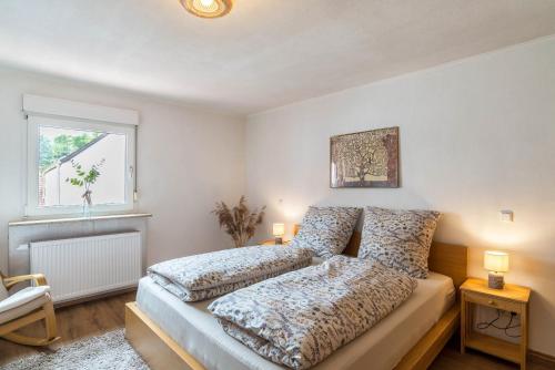 a bedroom with a bed and a window at Pfälzerwald Idyll in Schwanheim