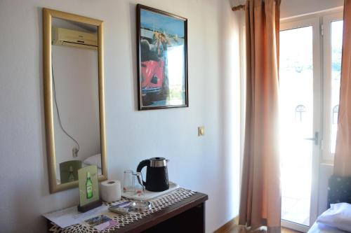 a room with a table with a coffee maker on it at Guest House Vera in Ulcinj