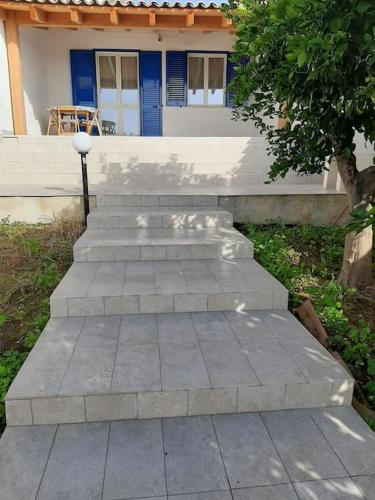 a set of concrete steps in front of a house at Casa vacanze Gemini in Triscina