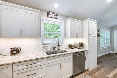 a kitchen with white cabinets and a sink at Creekside Cabin in Franklin about 8 Mi to Downtown! in Franklin