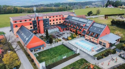 an overhead view of a building with a swimming pool at OREA Resort Panorama Moravský kras in Blansko