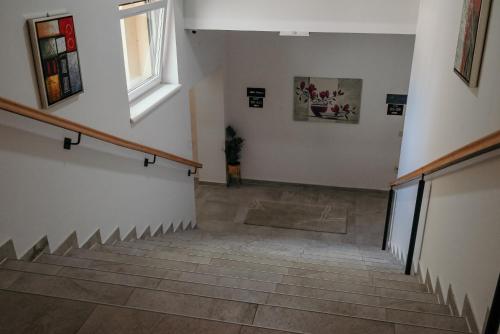a staircase in a building with a stair case at Boutique Hotel Ukus in Tešanj