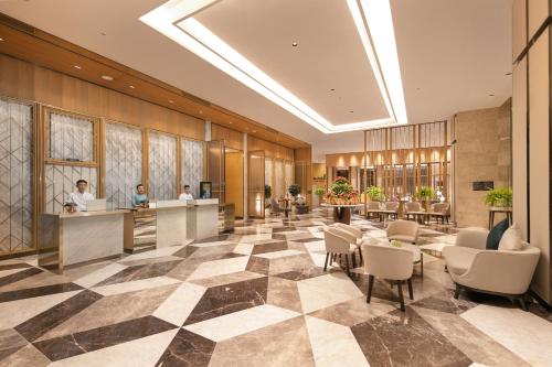 a lobby of a hotel with a check in counter at Grand Hyams Hotel - Quy Nhon Beach in Quy Nhon