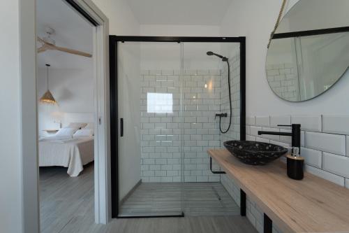 a bathroom with a sink and a mirror at Calas De Meca in Los Caños de Meca