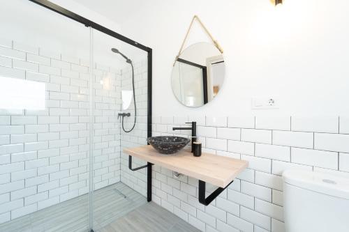 a bathroom with a sink and a mirror at Calas De Meca in Los Caños de Meca
