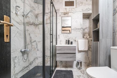 a bathroom with a shower and a sink at Villa MarLea in Dubrovnik