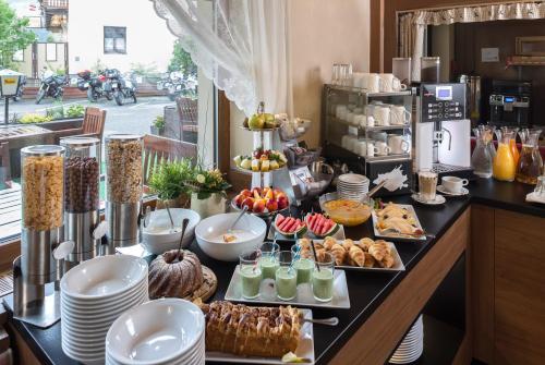a buffet of food on a table with food at Hotel Post Fusch in Fusch an der Glocknerstraße