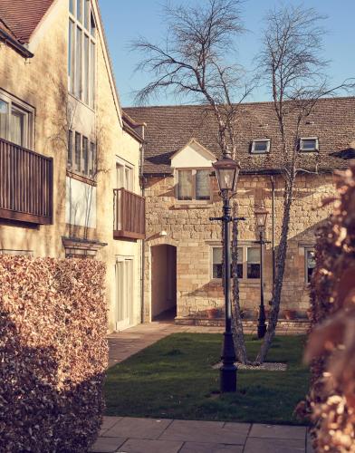 a street light in front of a brick building at Dormy House Hotel in Broadway
