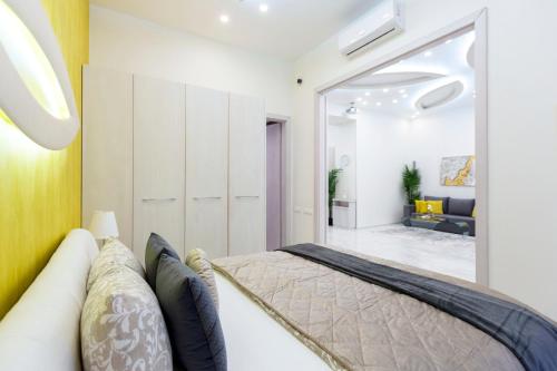 a bedroom with a bed and a large mirror at Luxurious Central Apartment next to the Danube River in Budapest