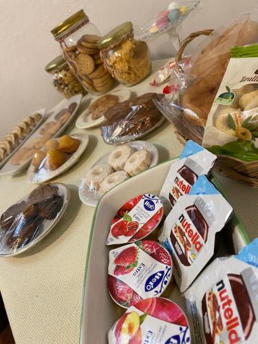 a table topped with different types of food on plates at La Casetta in Gerace
