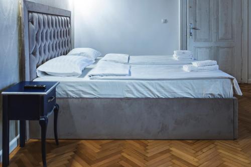 Кровать или кровати в номере Sia Boutique Aparthotel