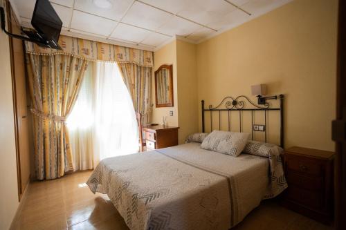 Posteľ alebo postele v izbe v ubytovaní Hotel Beatriz