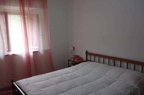 Łóżko lub łóżka w pokoju w obiekcie Casa immersa nella natura