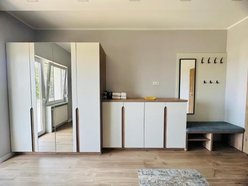 a living room with a mirror and a table at Villa Chiara Piemonte in San Salvatore Monferrato