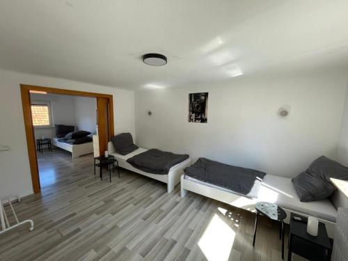 a living room with two beds and a couch at Cozy Apartment in Bad Vilbel in Bad Vilbel
