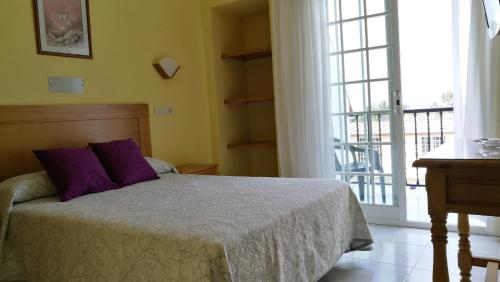 Кровать или кровати в номере Hotel Bonaire