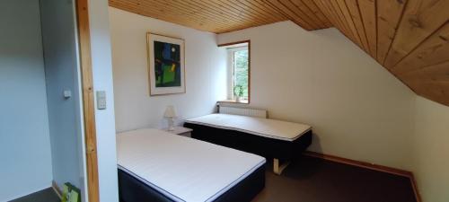Postel nebo postele na pokoji v ubytování Bøllingsø Camping