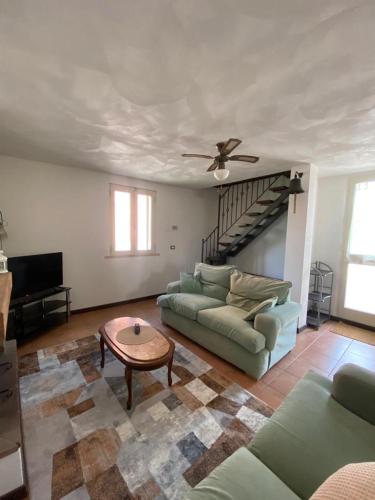 a living room with a couch and a table at Casa Simi in Chiesina Uzzanese