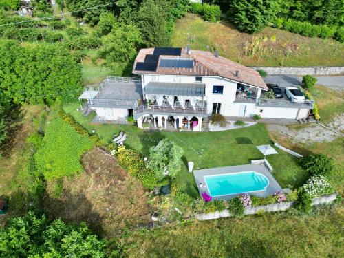 an aerial view of a house with a swimming pool at B&B Re' Perone in Anfo