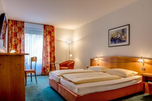 Postel nebo postele na pokoji v ubytování Hotel Panorama Hamburg-Harburg